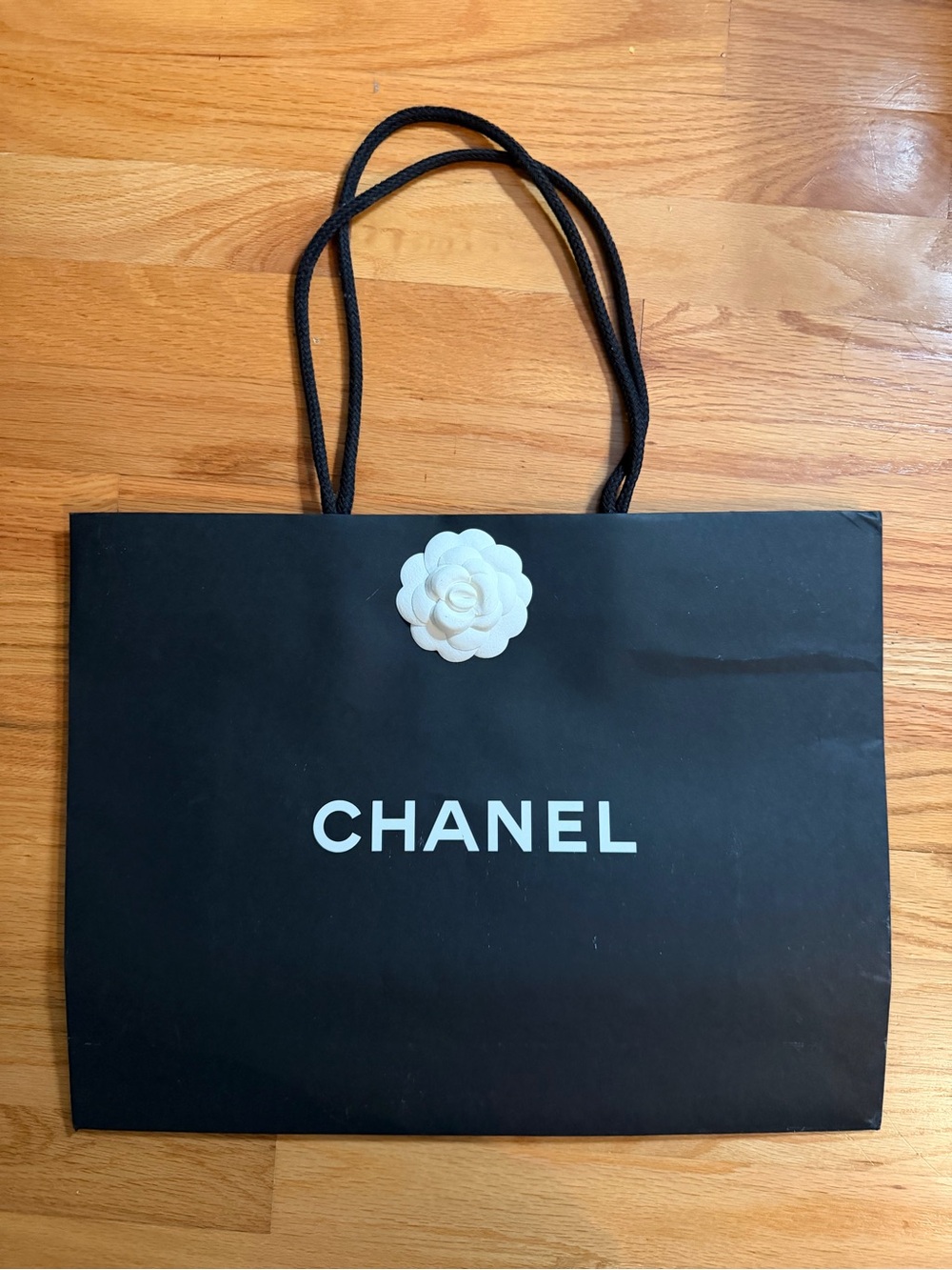 CHANEL Black Shopping Bag with White Camellia Accent